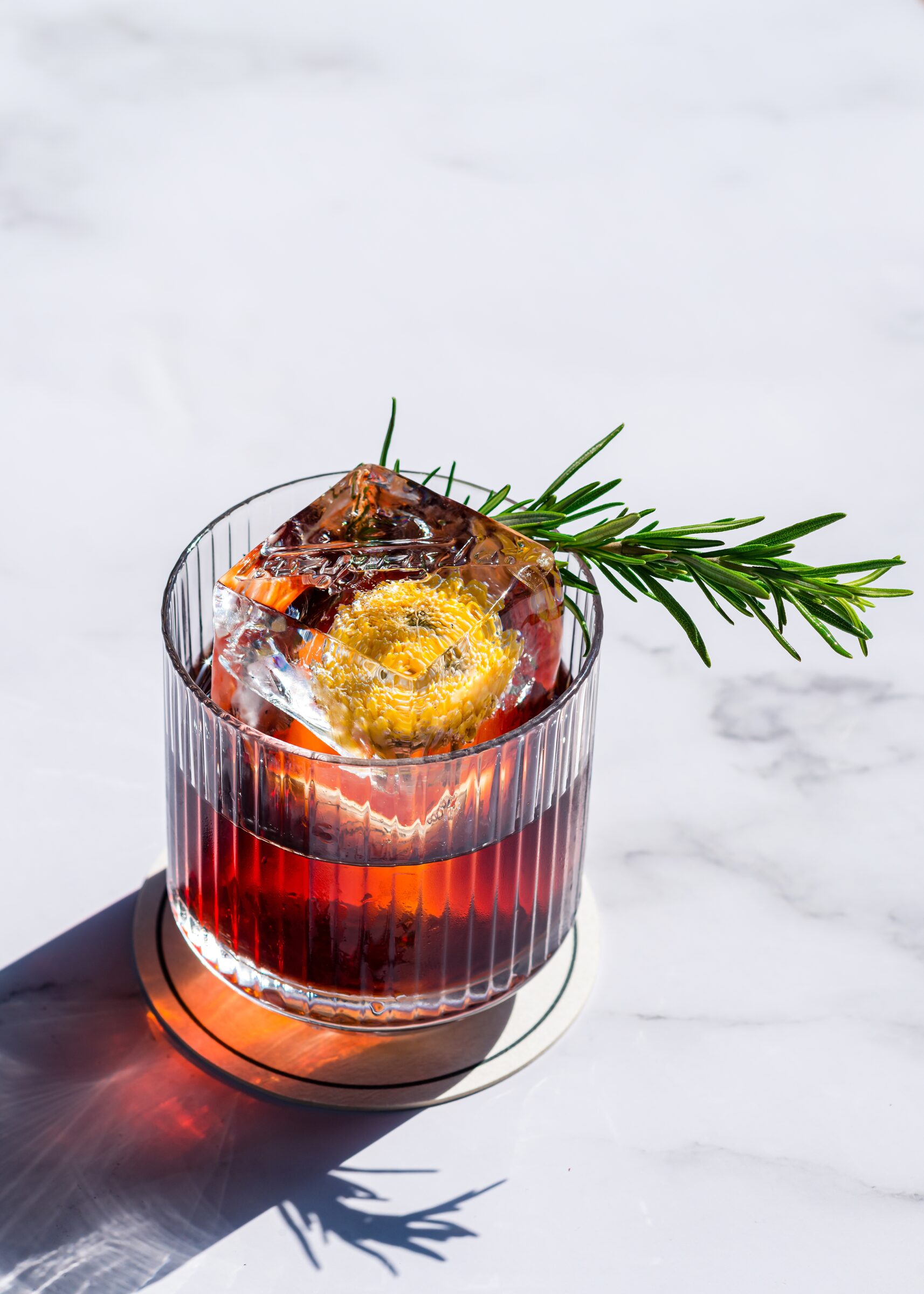 Alcoholic,Cocktail,Negroni,With,A,Block,Of,Ice,On,A